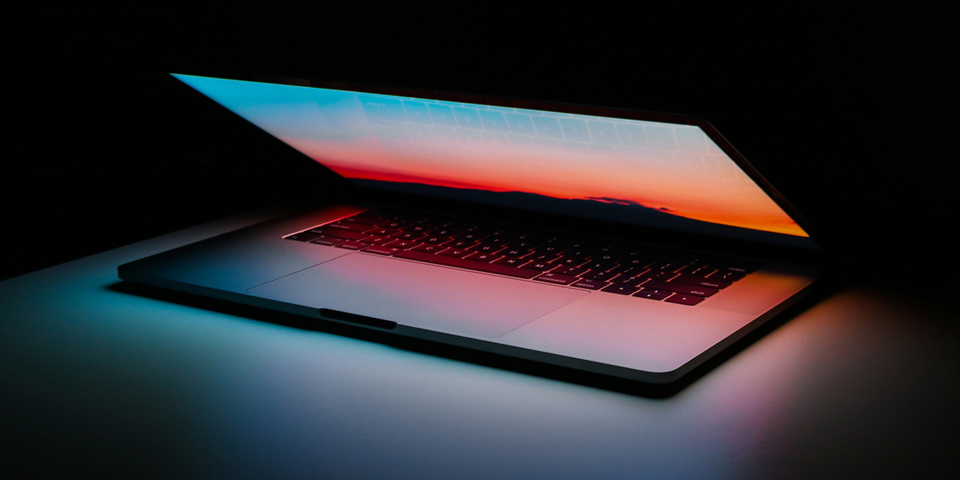 Picture of a half closed laptop on a table
